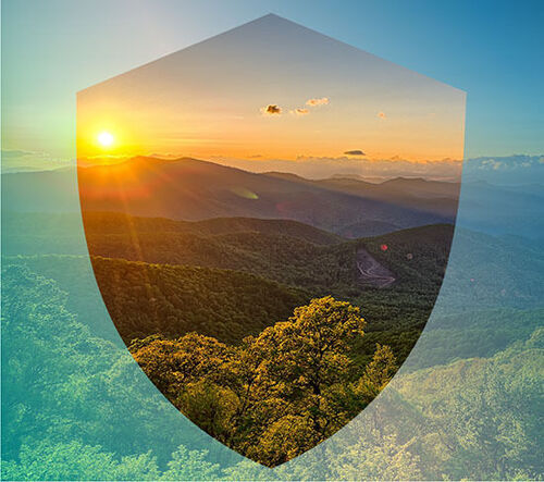 Image of a shield overlaying a landscape